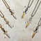 Two-tone steel Flower dagger pendants on chains